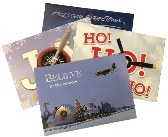 Collection of Christmas cards with winter scenes and festive text.