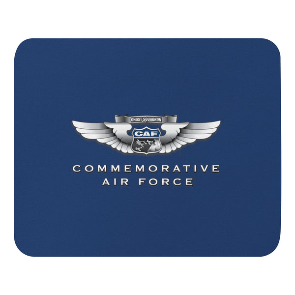 A blue mouse pad with the Commemorative Air Force logo centered on it.