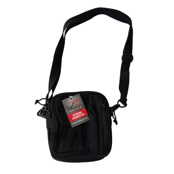 A canvas crossbody bag with multiple compartments, an adjustable shoulder strap, and a visible brand tag.  Available in black or brown.