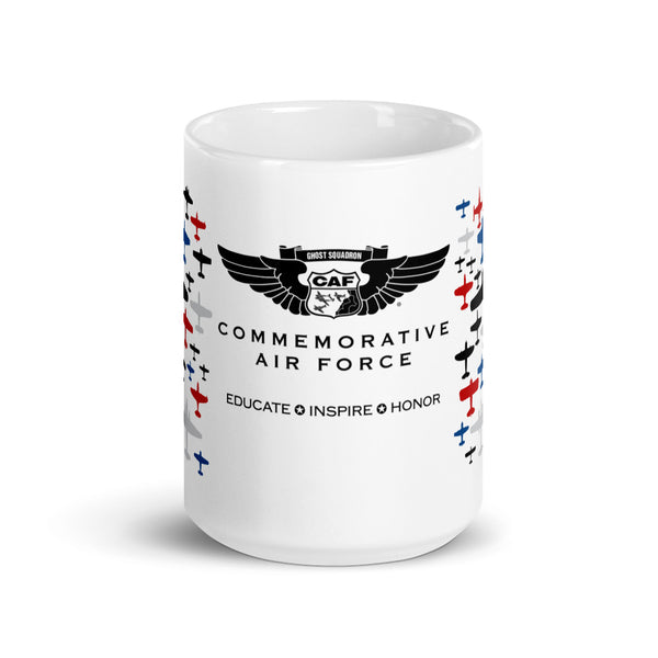 A white ceramic mug with a colorful print featuring aircraft and the text 'CAF Commemorative Air Force EDUCATE INSPIRE HONOR'.