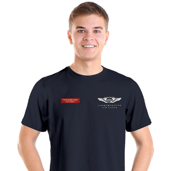A person wearing a black T-shirt with a red and white name tag on the left sleeve, featuring text related to the CAF Cadet program.